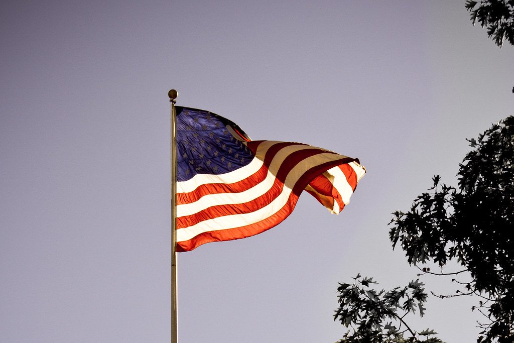 American flag flying outdoors against a clear sky