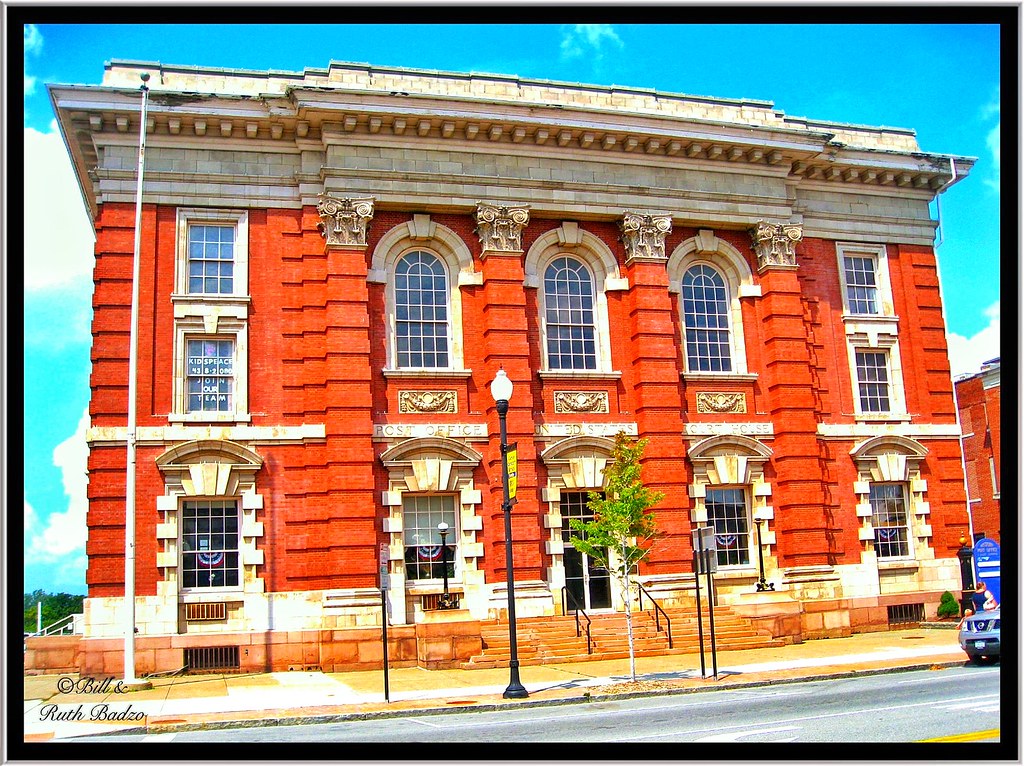 Historic red brick civic building with tall windows