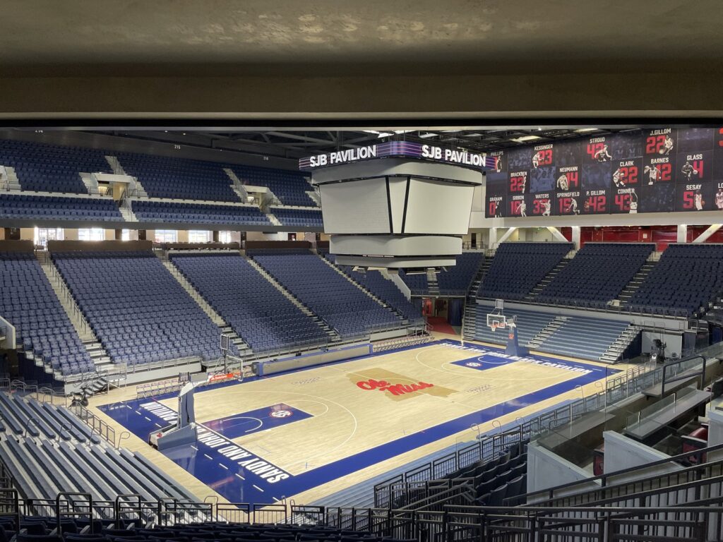 Basketball on hardwood court near free-throw line